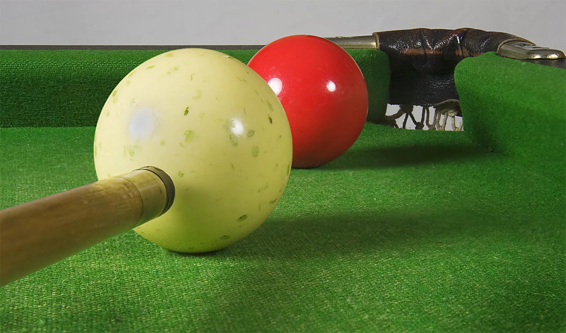 A player leans over the table lining up a shot