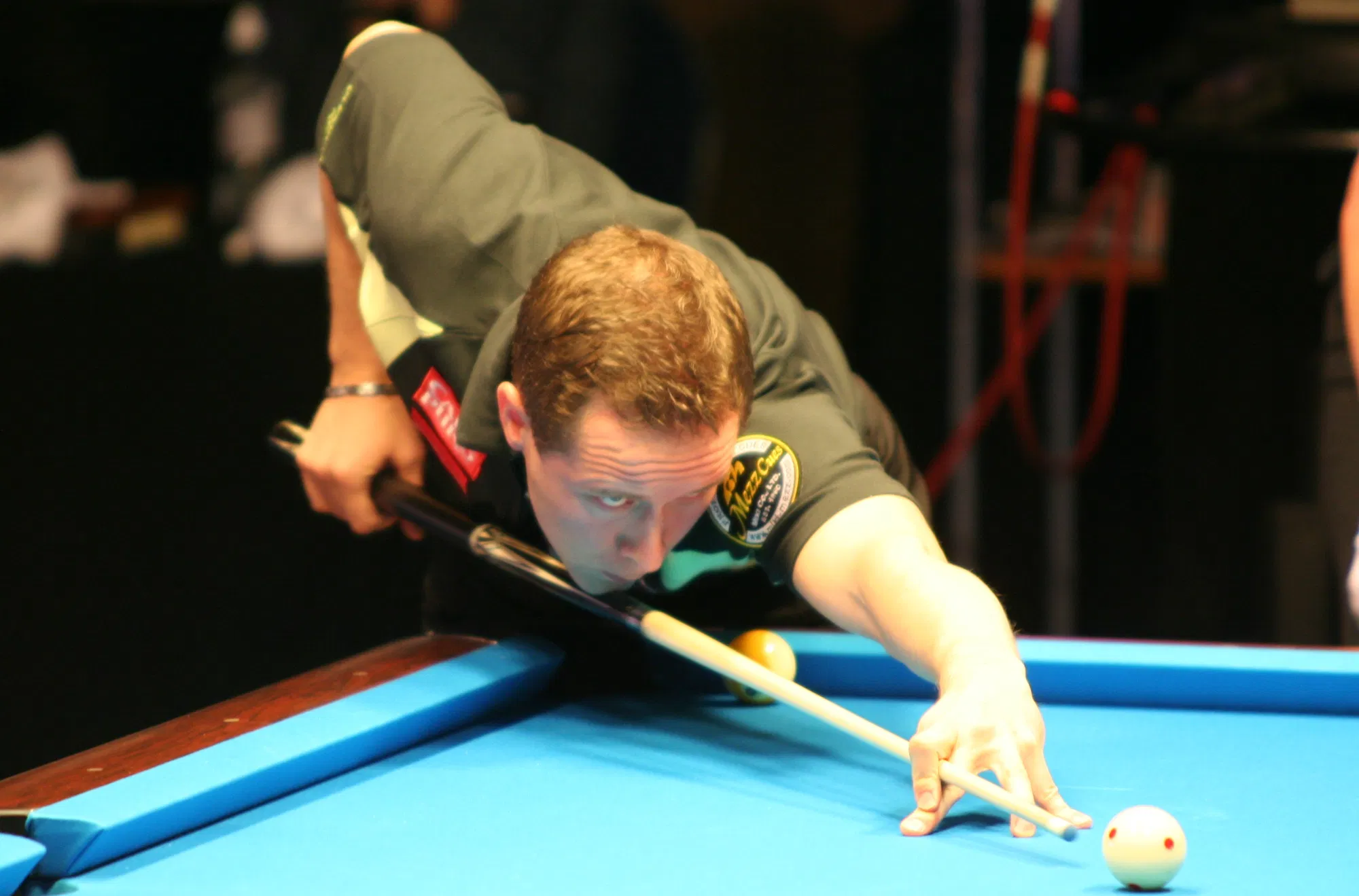 A professional player competes in a televised arena match (Photo: Christian Werner, CC BY 3.0, via Wikimedia Commons)